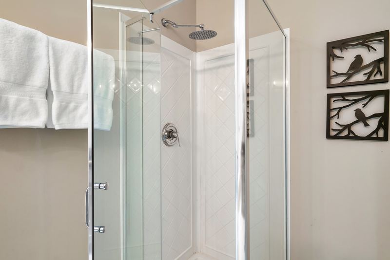 Glass walk-in shower in the lower-level bathroom